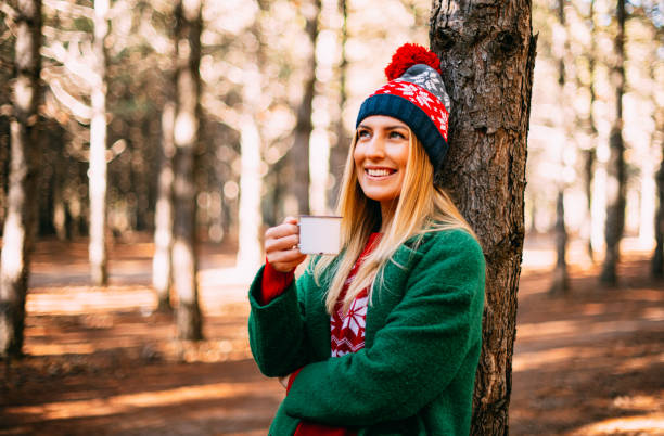 istock Cute Woman is Drinking Tea in the Forest 1195332004