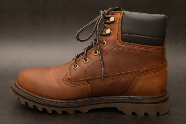 leather boot isolated on black background