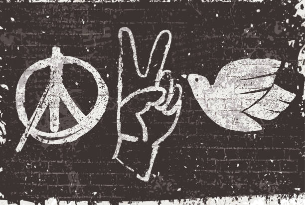 Peace symbols graffiti on a black wall Vector illustration of peace symbols, the graphic symbol of peace, a hand in a victory gesture and a dove, in graffiti-style on a grunge black wall texture background. v sign stock illustrations