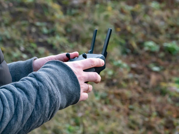 istock The quadrocopter control panel in the hands of a man. 1195357230