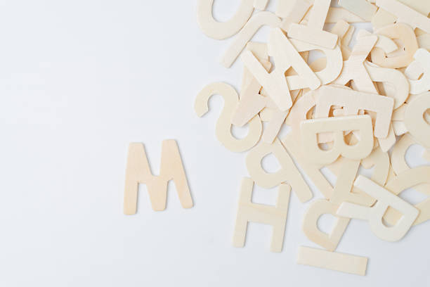 istock ABC english wood letters on white blackground 1195358804