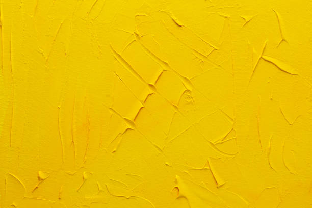 istock abstract yellow grunge stucco wall backdrop 1195362134