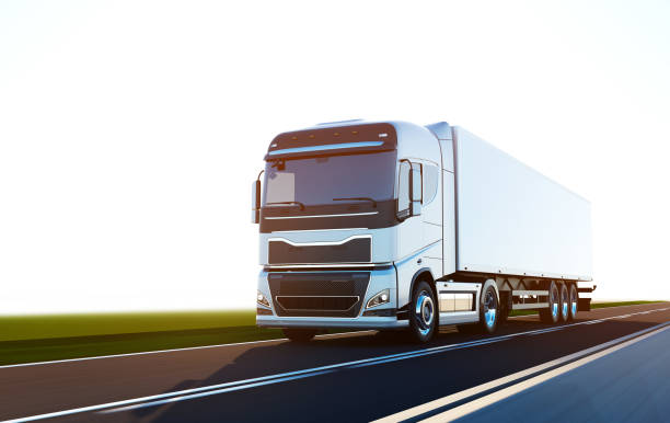 istock semi-truck with trailer driving on road 1195362884