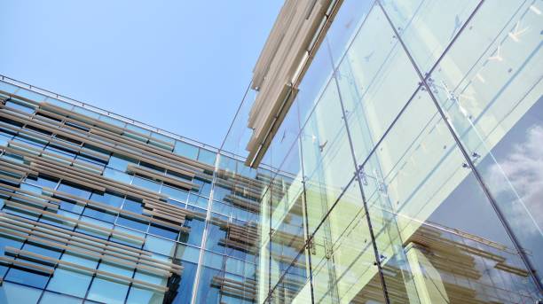 istock Modern office building with reflection in windows of building 1195369129