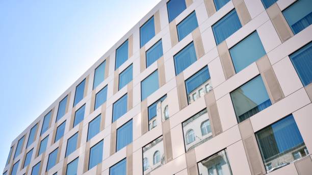 istock Modern office building with reflection in windows of building 1195369176