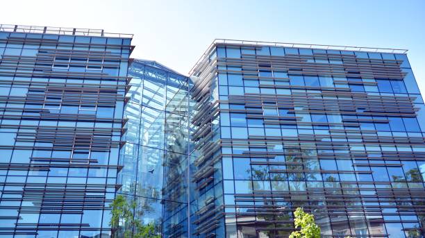 istock Modern office building with reflection in windows of building 1195369286