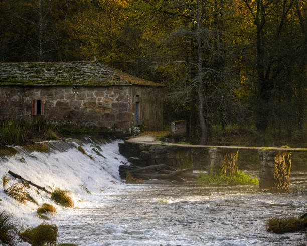 istock Old traditional mill with its dam 1195369443