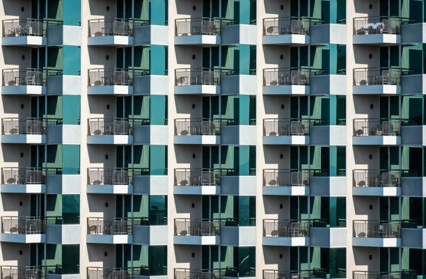 istock Pattern of hotel room balconies in modern building. Art 1195372032