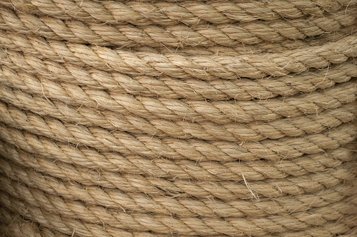 Texture of coiled sisal rope. Several layers of thick rope as background