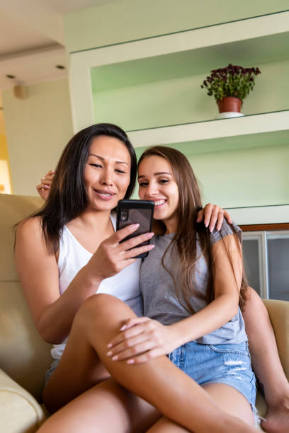 istock Young Lesbians Browsing the Internet for Online Shopping 1195374312