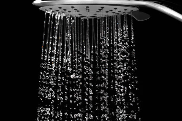 istock Water jets from the shower on black 1195374455