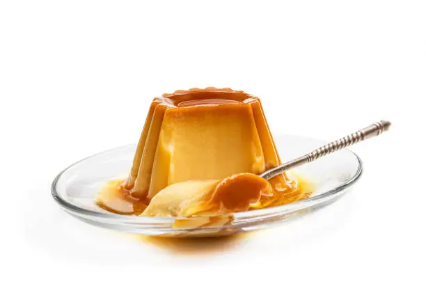 Creme  caramel custard pudding isolated in white