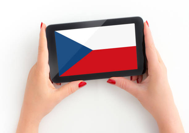 istock Woman holds her tablet with czech Flag 1195376540
