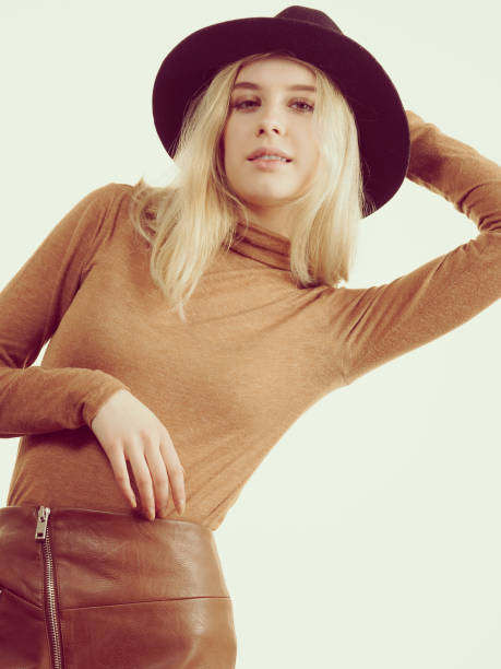 istock Woman wearing suede and black hat 1195377527