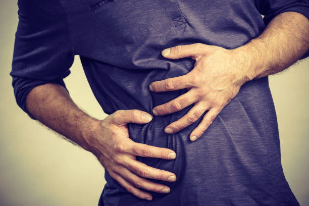 istock Man feeling stomach ache pain 1195378373