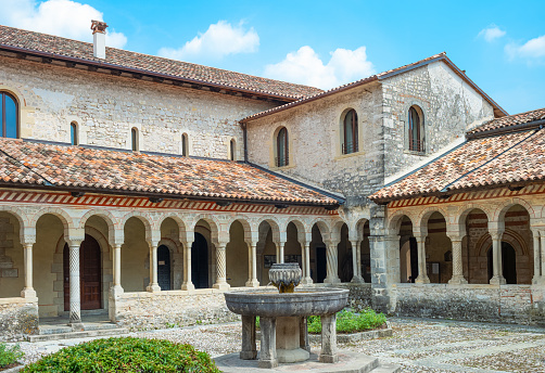 Follina, Italy - July 20,2019:  The cloister of the Cistercian Abbey of Santa Maria