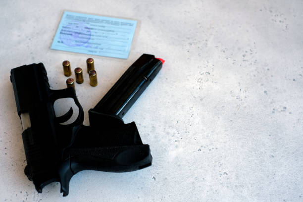a pistol 9 mm and bullets to him stock photo