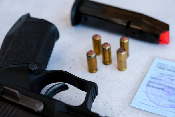 a pistol 9 mm and bullets to him stock photo