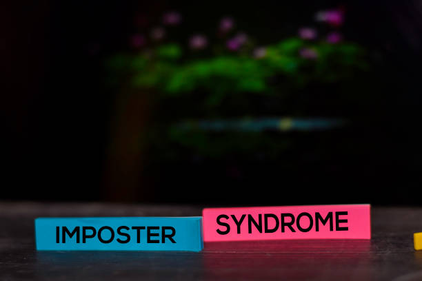 istock Imposter Syndrome text on sticky notes isolated on bokeh background 1195380652