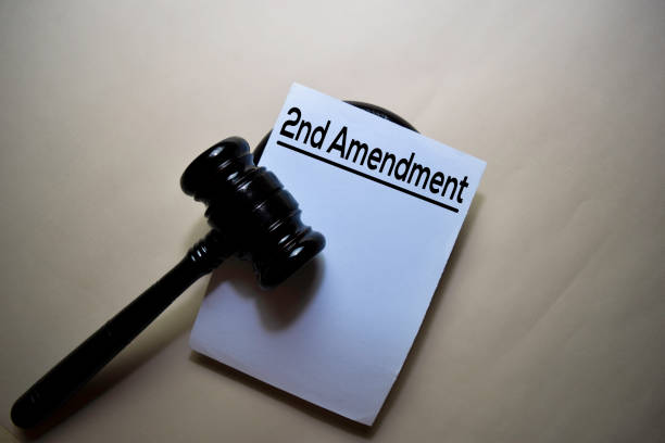 istock 2nd Amendment text on Document and gavel isolated on office desk. Justice law concept 1195380909