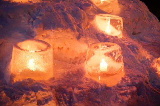istock Candle light in ice and snow on Christmas day 1195380979