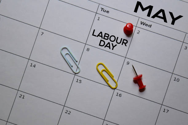 istock Labour Day text on calendar and Pinboard. Schedule, reminder concept 1195381500