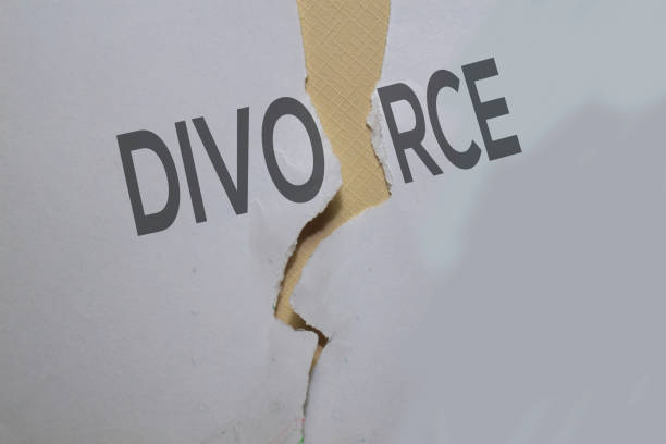 istock Divorce Text on paper background with crack in the middle 1195381769