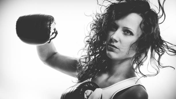 istock Boxer girl exercise with boxing gloves. 1195382842