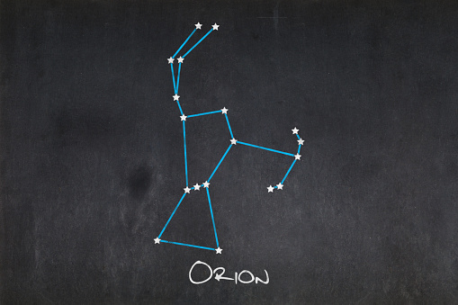 Blackboard with the Orion constellation drawn in the middle.