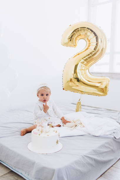 istock The child eats cake with appetite. Birthday baby. 1195387213