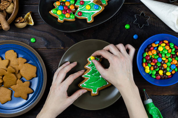 istock A hands decorates cookies with candy 1195388130