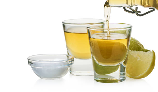 istock strong drink is poured into a glass 1195391710