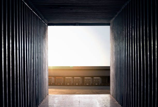 istock inside view an empty of a truck container with a trucks parking at warehouse. 1195393604