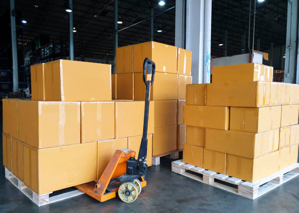 istock Hand pallet truck with stack cardboard boxes or package shipment sending to customers 1195393637