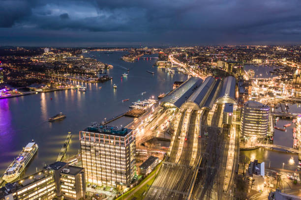 istock Amsterdam Centraal Railway Station at Night Aerial View 1195393675