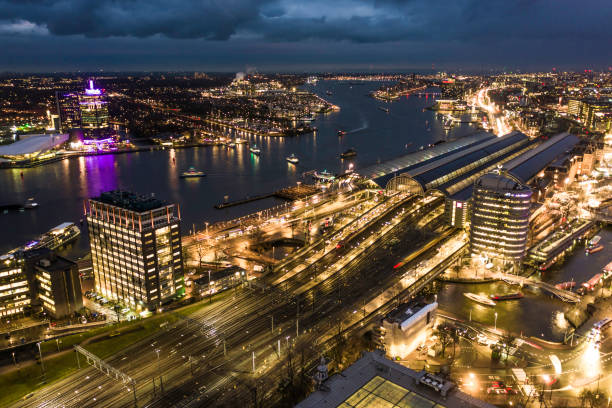 istock Amsterdam Centraal Railway Station at Night Aerial View 1195393726