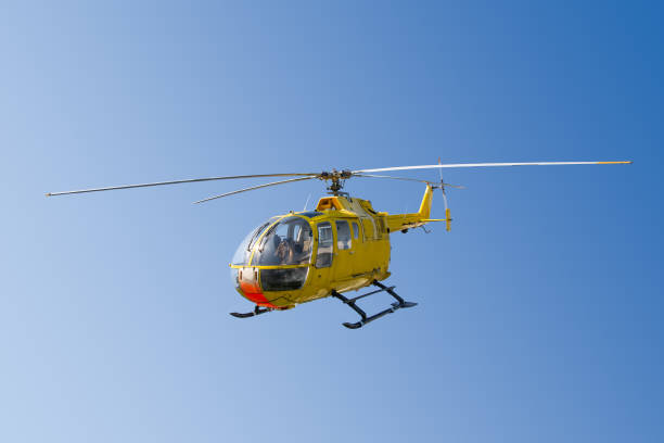 istock Flying yellow rescue helicopter 1195393737