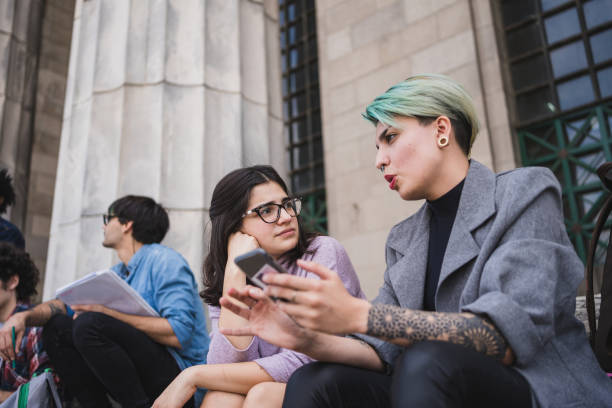 istock Latino-american university students learning together outdoor 1195399362