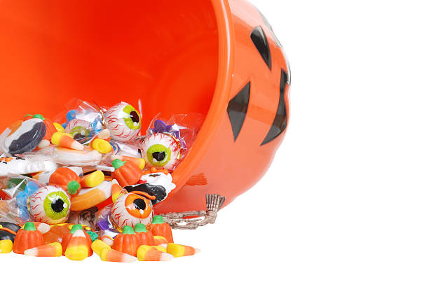istock macro spilled halloween candy and pumpkin bucket 119539993
