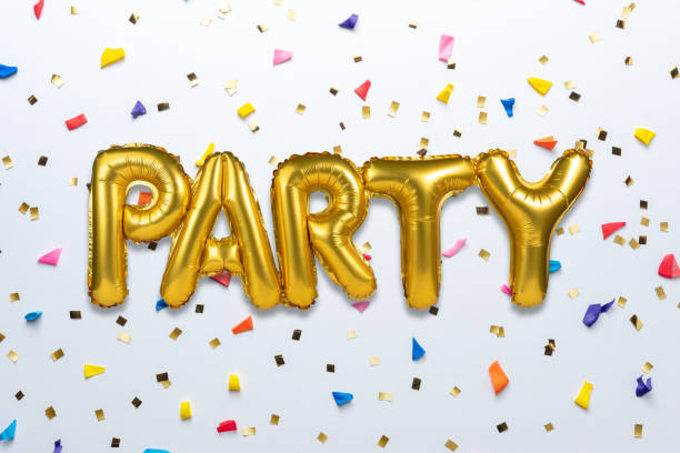 istock Creative composition made with Party foil balloon and party confetti on white background. Minimal celebration party concept. 1195400620