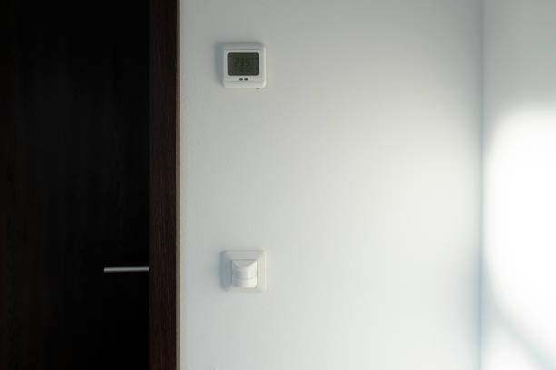 Smart home system. The room has a motion sensor to turn on the light. There is a climate control of the temperature in the room.