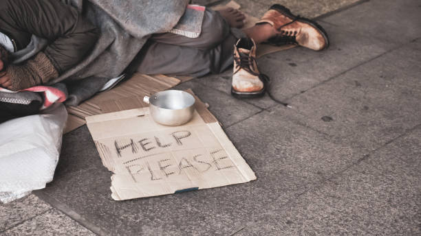 istock Homeless man sleeping on outdoor floor. 1195407723