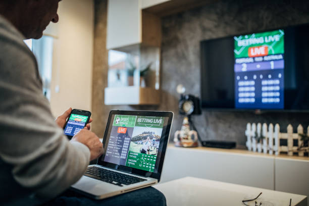 istock Senior man bets on soccer game 1195409461