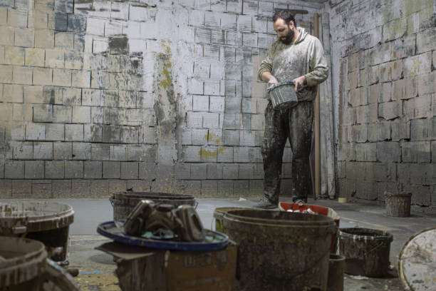 istock Young artist preparing his art studio for paiting with paint and canvas 1195410466