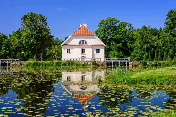 A small red house by a lake in the Harz Mountains