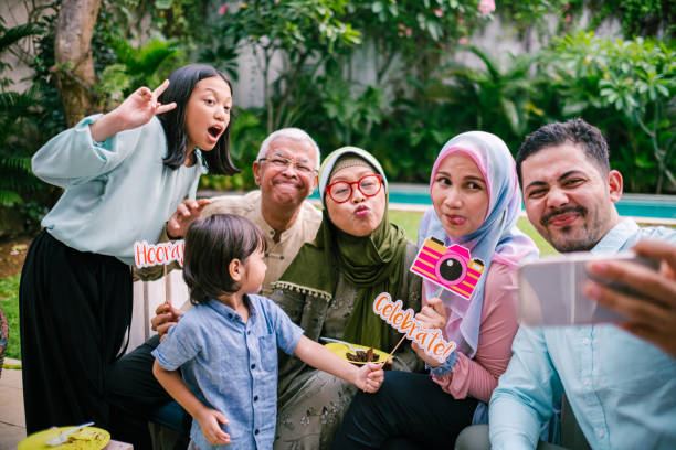 istock Happy Family Taking Selfie During Birthday Celebration 1195413791