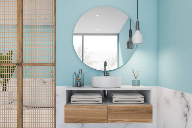 istock White marble and blue bathroom, tub and sink 1195414911