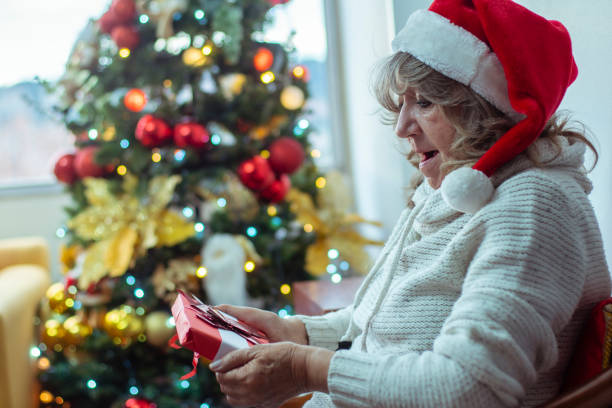 istock Grandma receiving a christmas gift 1195418437