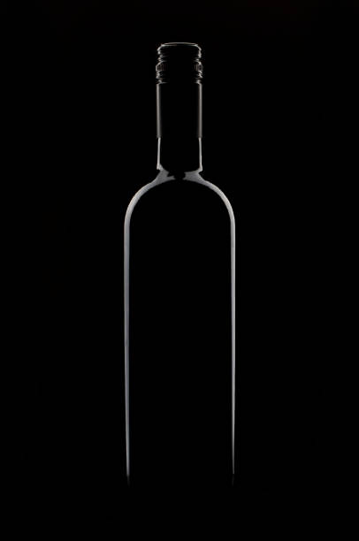 istock Red Wine bottle silhouette isolated on black background 1195424126
