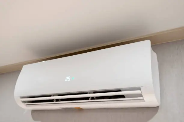 Photo of Inverter Air conditioner install on modern grey wall colors interior design for urban business office idea and fresh air breathing for healthy condition concept